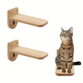 Two solid wood floating cat steps with a cat sitting on one