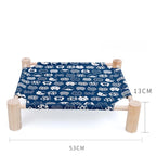 Raised canvas cat bed on wooden legs