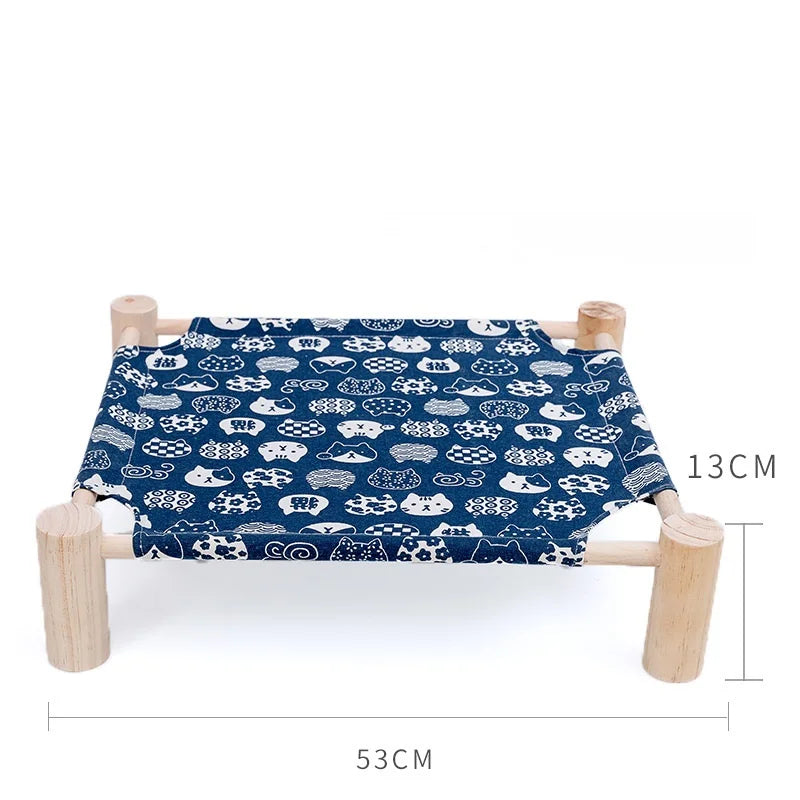 Raised canvas cat bed on wooden legs