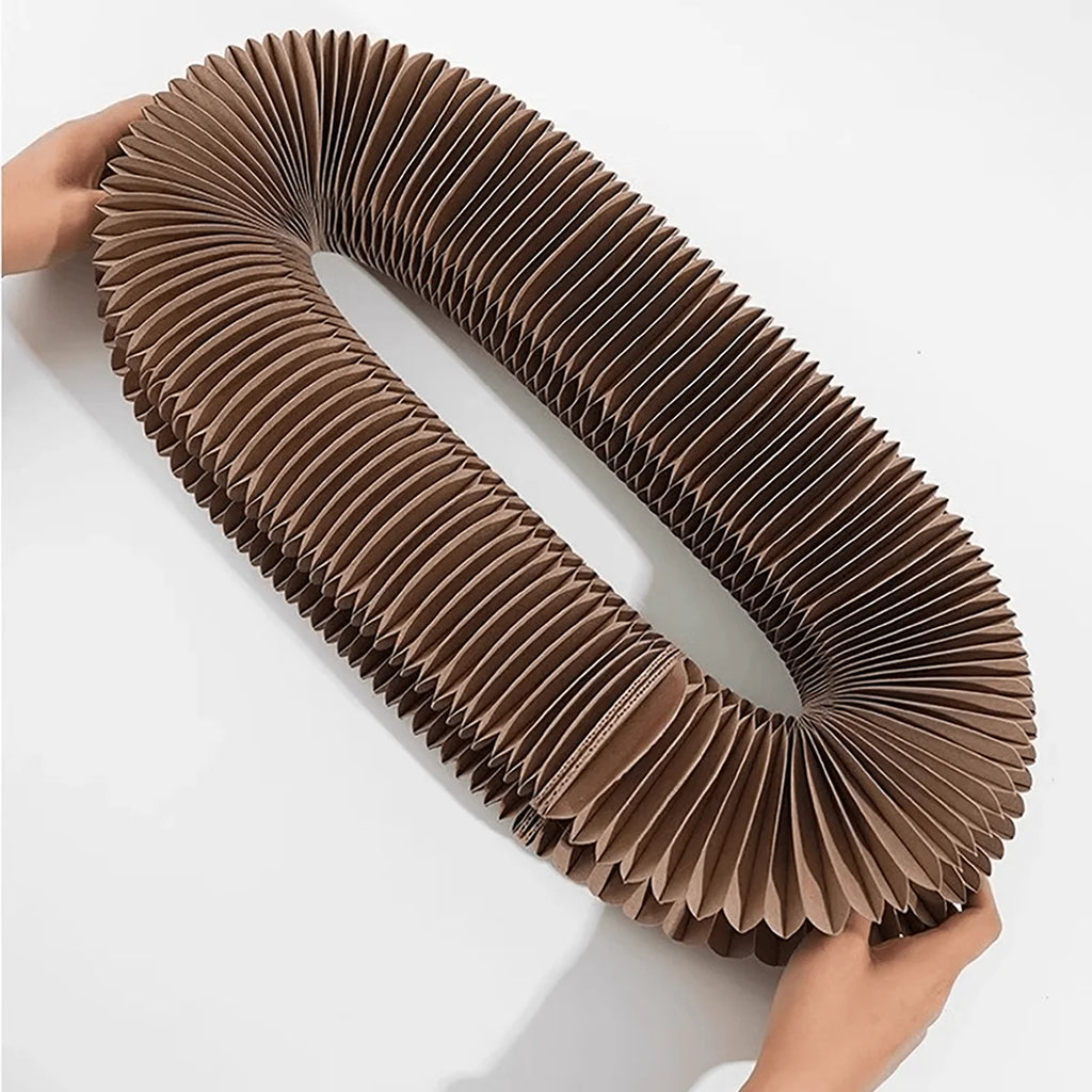 Cardboard scratcher folded flat and opened into a ring