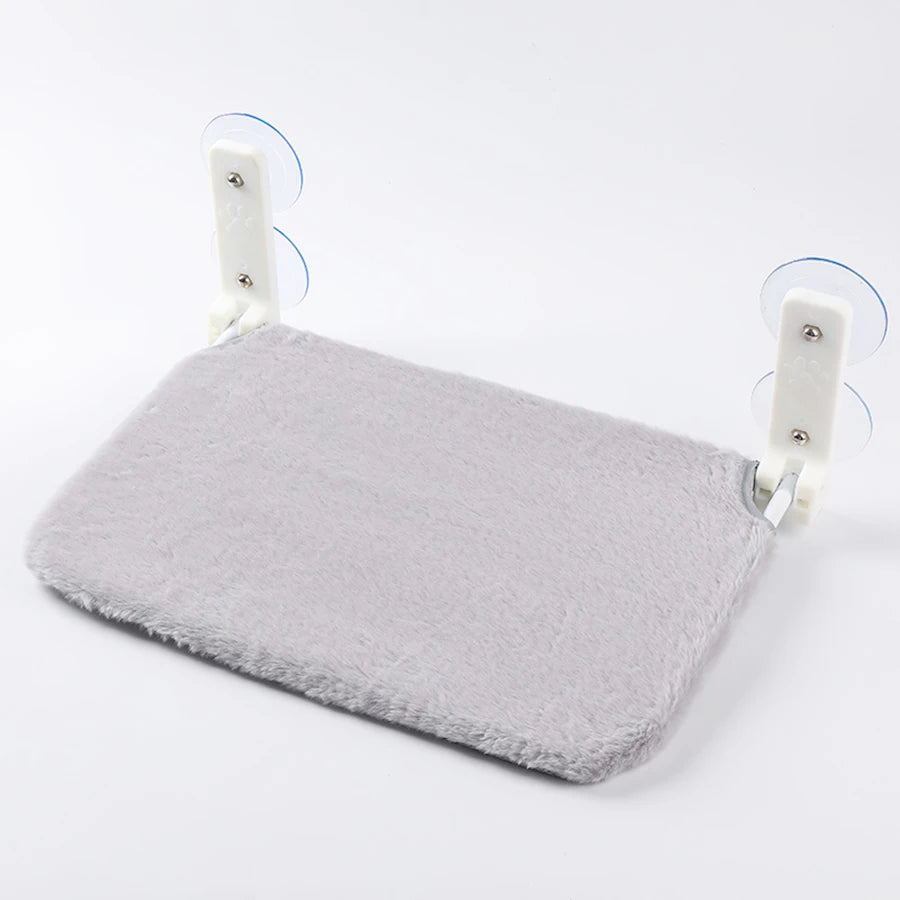Folding mesh window hammock on suction cups