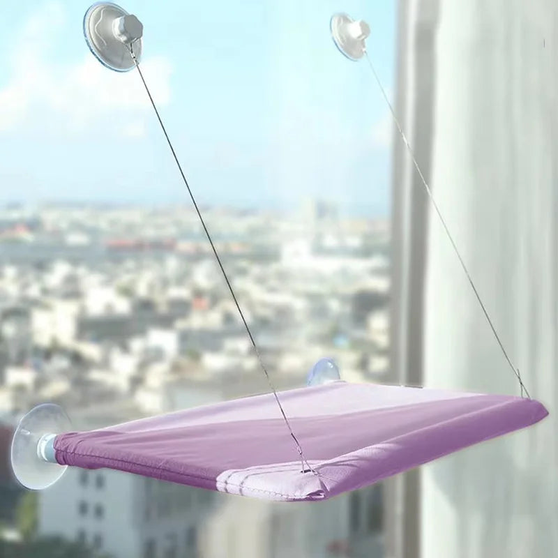 Suction cup and cable detail of the window hammock