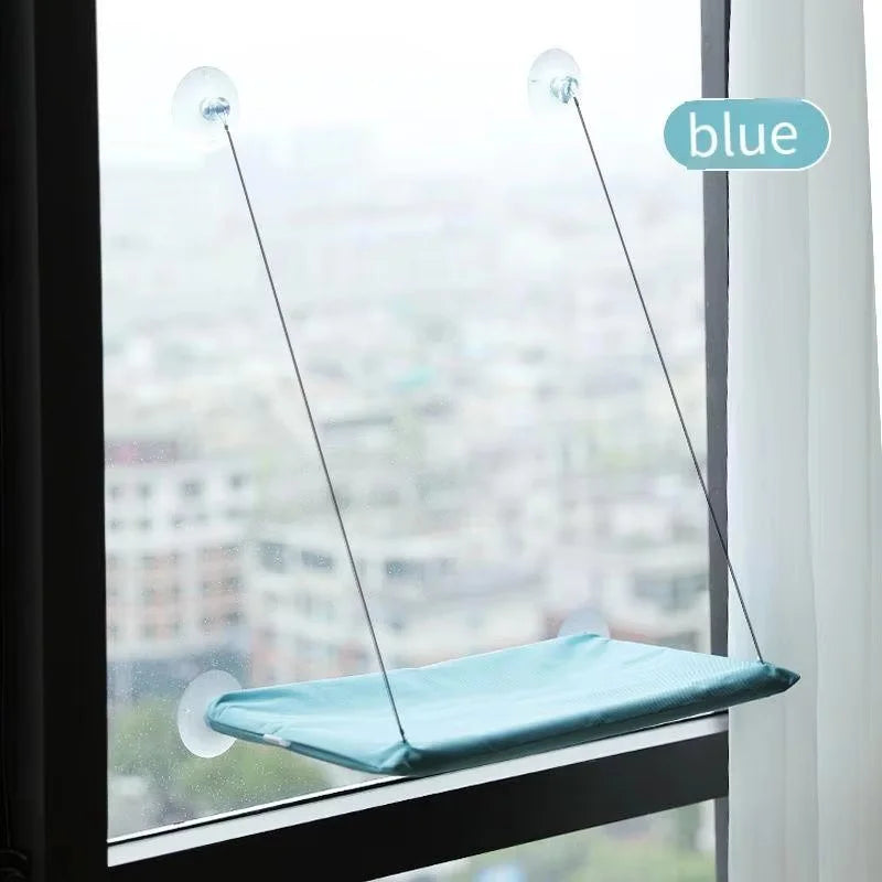 Cat window hammock hanging on glass with suction cups