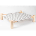 Raised cat bed with grey triangle canvas on a solid wood frame