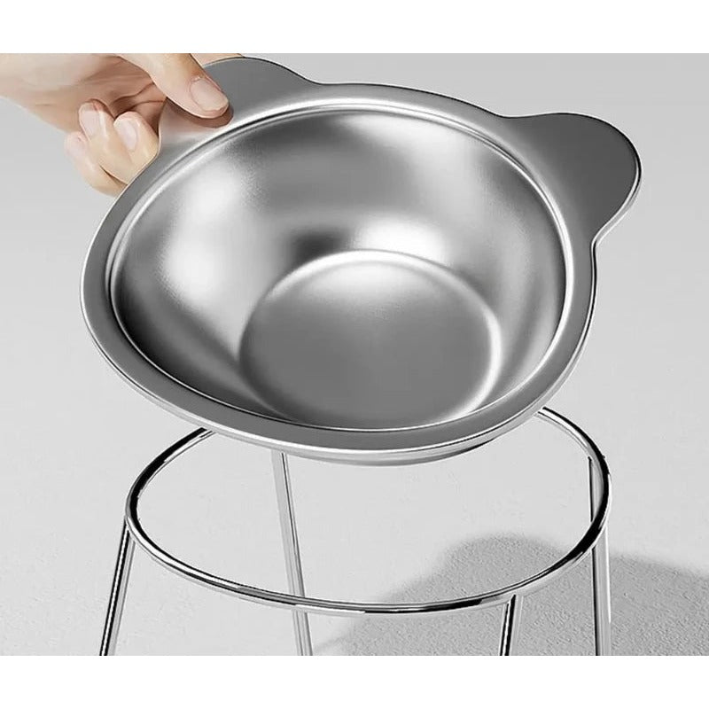 Stainless steel raised cat bowl on a tilted metal stand